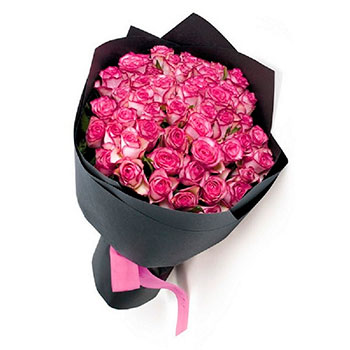 Bouquet of pink roses in kraft paper