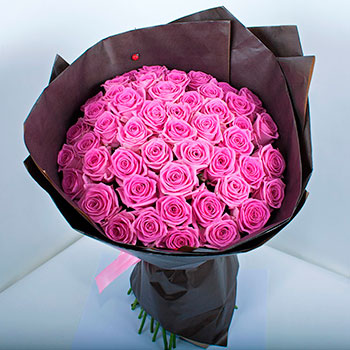 Bouquet of pink roses Aqua in kraft paper
