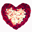 Heart of red roses and candies