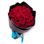 Bouquet of red roses  in kraft paper